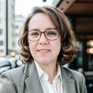 Woman in glasses, professional headshot.